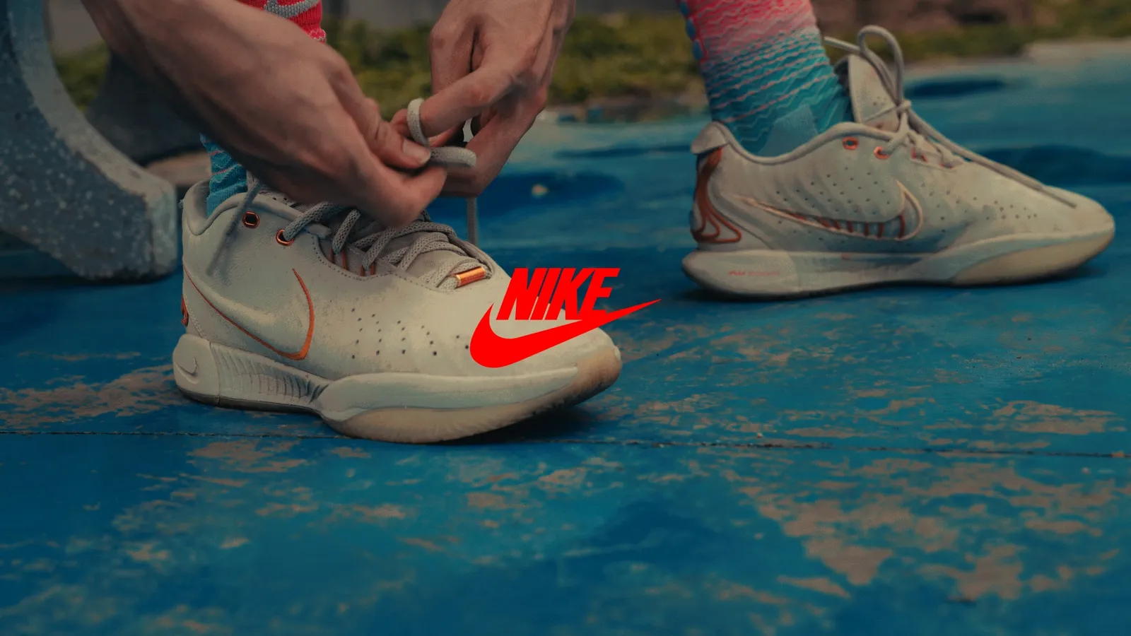 Lacing up white Nike basketball shoes