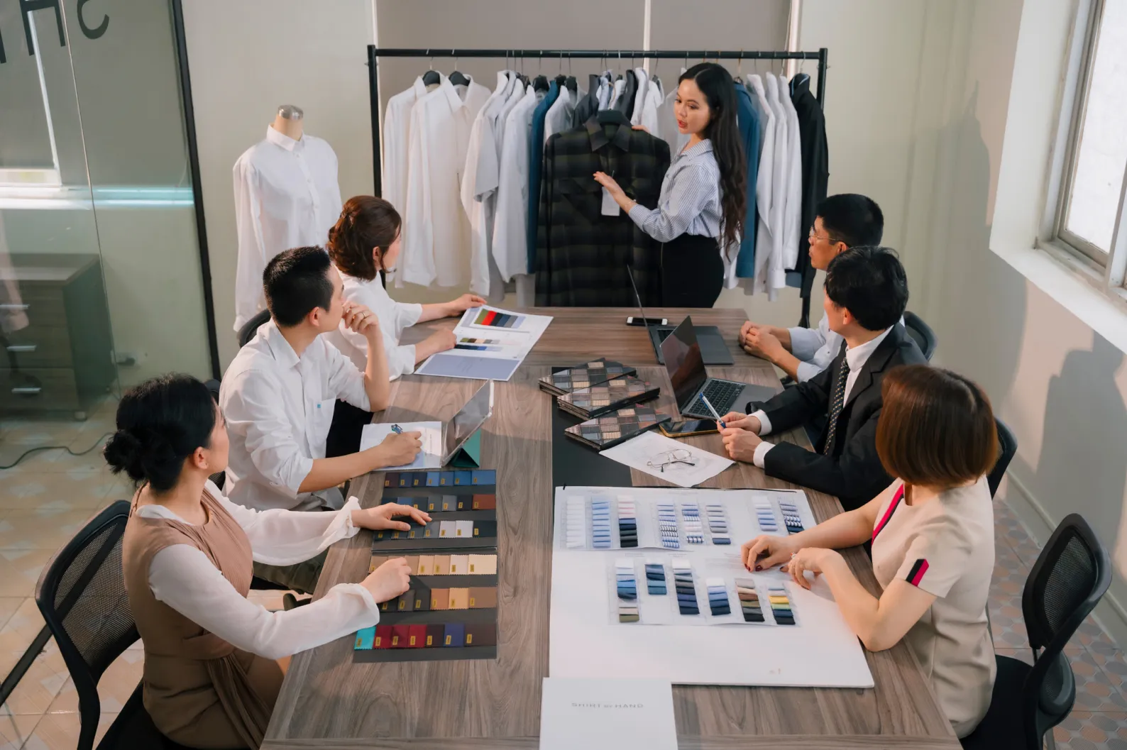 The design team going through fabric swatches